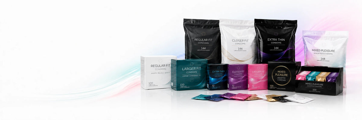 A collection of hair extension packaging products, including black and white pouches, a white box, a teal jar, a purple jar, and several colorful individual packets, arranged on a reflective white surface with a clean white background and subtle pastel light streaks.